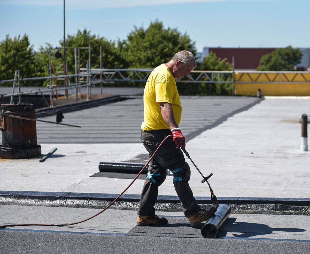 Roof works being performed on an apartment block / residential block restore the roof to working order