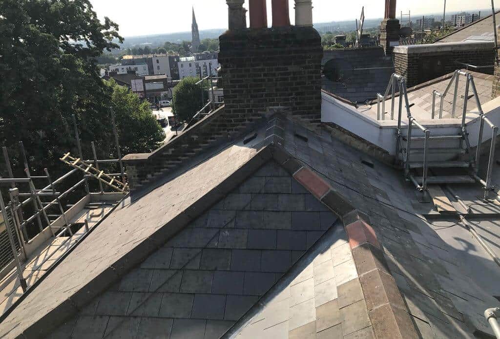 Rooftop of the development shows multiple different slops and a chimney block