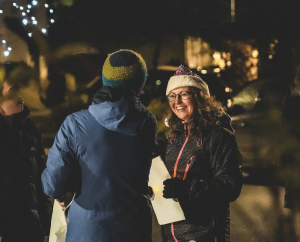Image of two neighbours chatting and smiling.