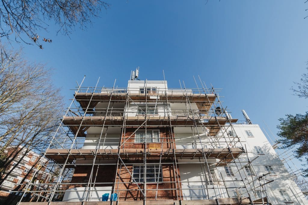 Scaffolding scales the length of the building during the works