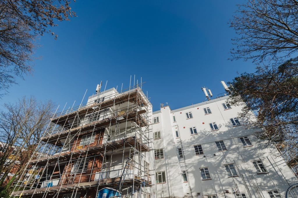 Scaffolding scales the length of the building during the works