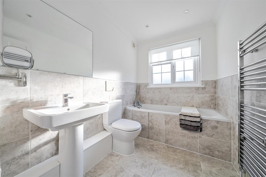 A bathroom photo shows high quality furnishings.