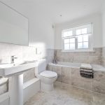 A bathroom photo shows high quality furnishings.