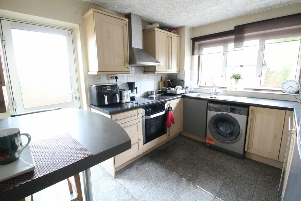 Image shows a kitchen with poor lighting composition