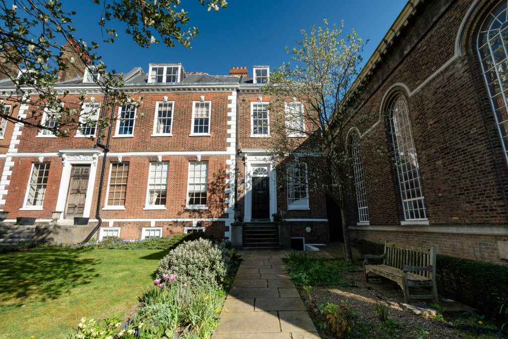 Spencer House & Apartment Entrance, pictured in the shadow of the Angelician Church - also a listed building.