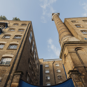 A high-rise residential building stretches into the sky.