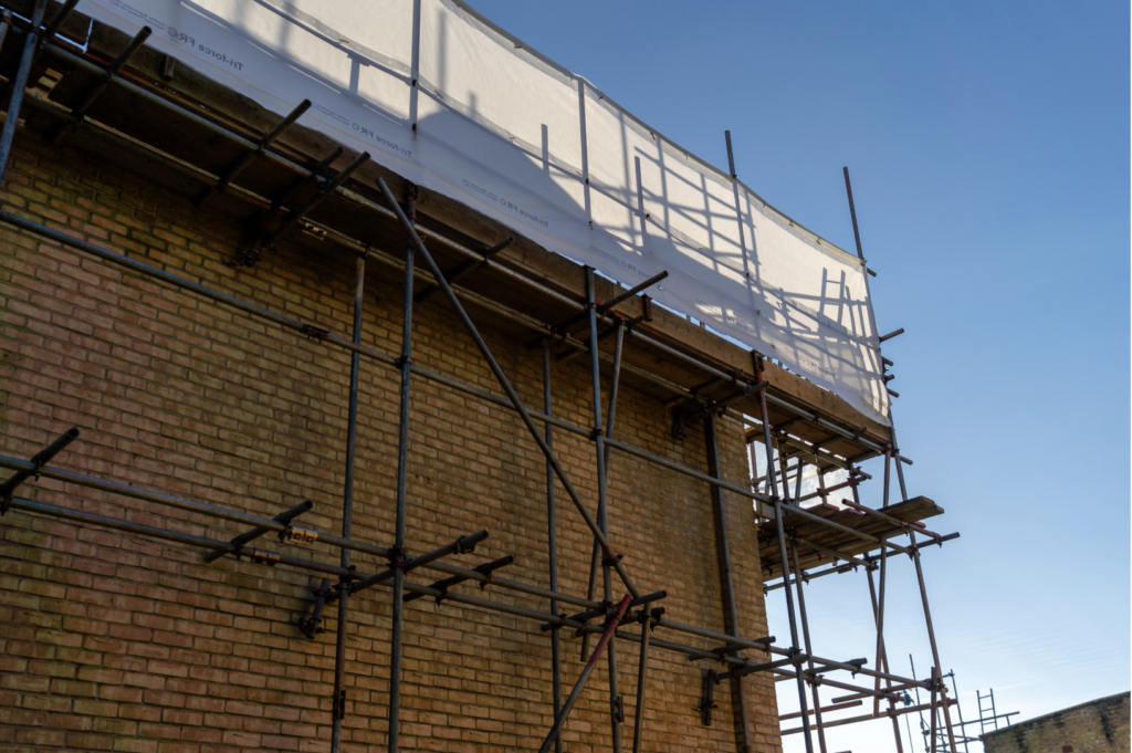 Scaffolding on the side of the building shows that roof works are underway