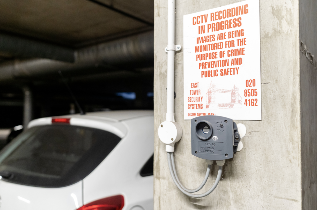 A sign in the car park shows a CCTV is in operation warning