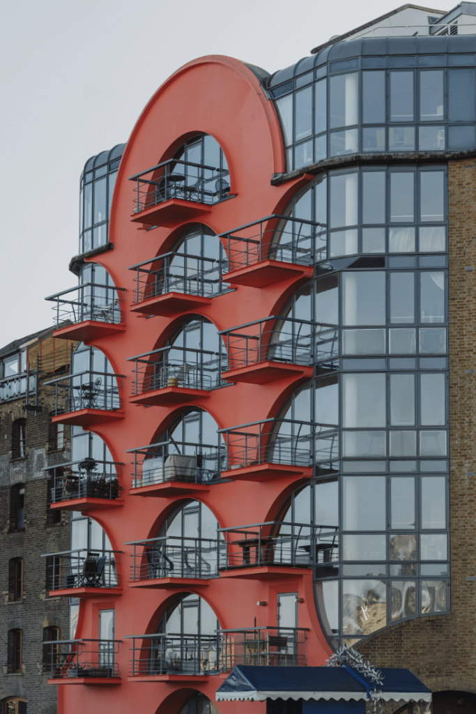 The iconic exterior of this Grade-II listed development is bright red, art-deco style, contrasting brilliantly with the glass facade of the rest of the development.